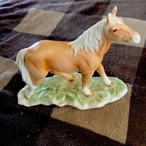 Goebel porcelain horse on grass